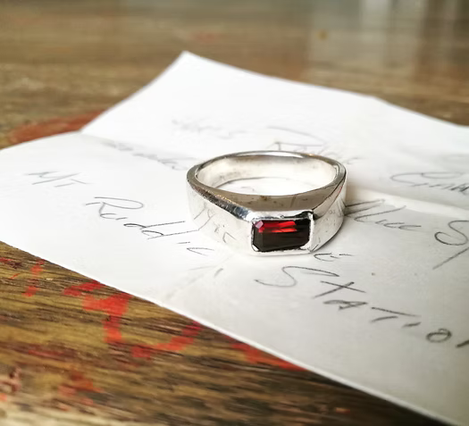 A Men's silver ring set with a Garnet from Australia