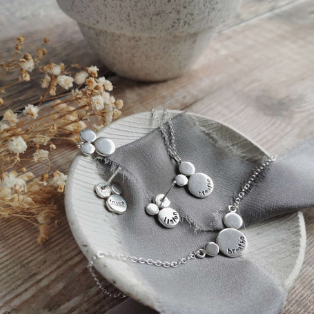 recycled silver necklaces and stud earrings with hand stamped words as a personal mantra