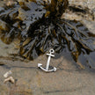 Silver anchor pendant in a cornish rockpool with seaweed
