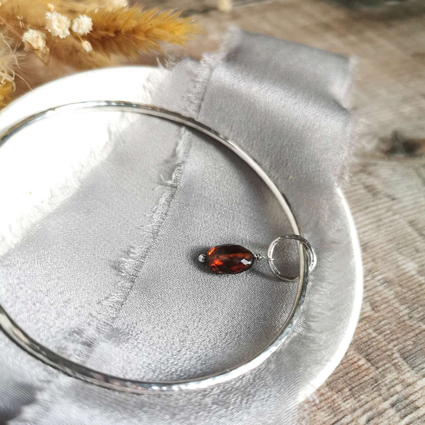 Silver Bangle with Garnet charm