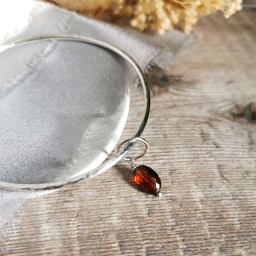 Silver Bangle with Garnet charm