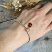 Silver Bangle with Garnet charm