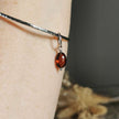 Silver Bangle with Garnet charm